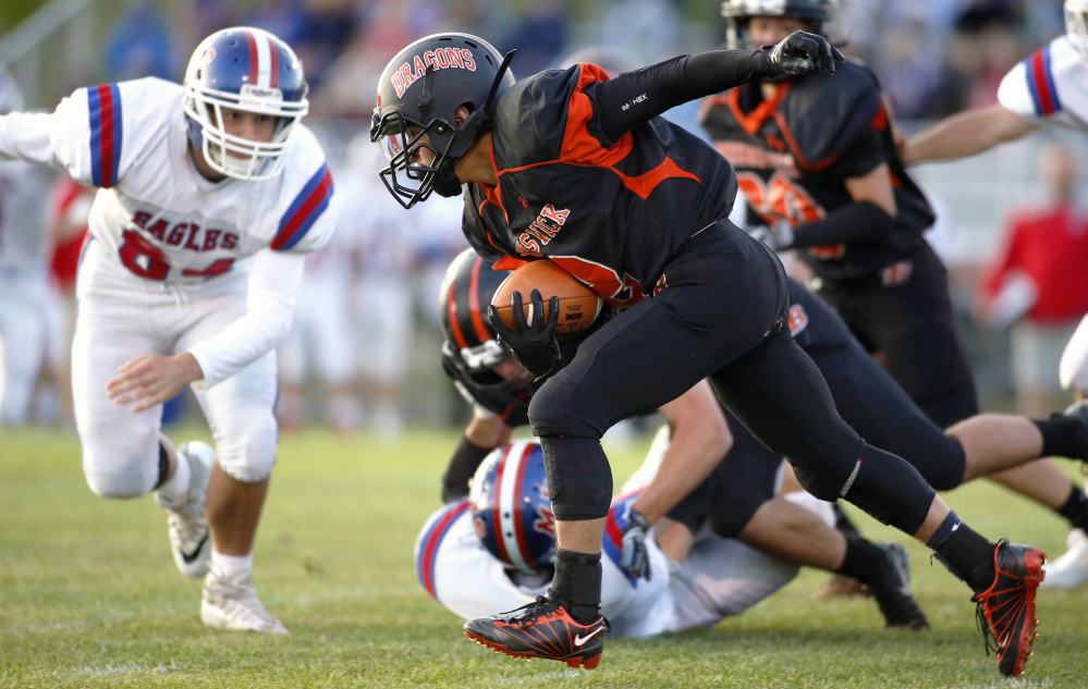 Brunswick's Dalton Dickey picks up some yards against Messalonskee during a Pine Tree Conference B game Friday in Brunswick.