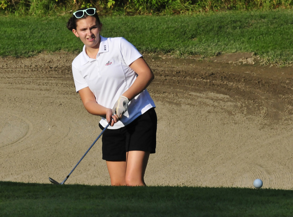 Messalonskee junior Emily Larsen watches her shot during a Kennebec Valley Athletic Conference match against Cony on Monday at Belgrade Lakes Golf Course.