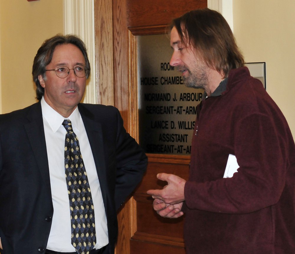 Rep. Drew Gattine, D-Westbrook, left, speaks with Dawson Julia, owner of East Coast CBD's, a licensed medical-marijuana provider in Unity, before Monday's special session.