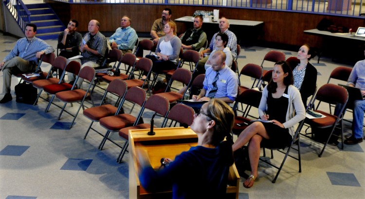 Sue Jones, president of Community Energy Partners, discusses renewable energy options for rural small businesses and agricultural producers Wednesday at Colby College in Waterville.