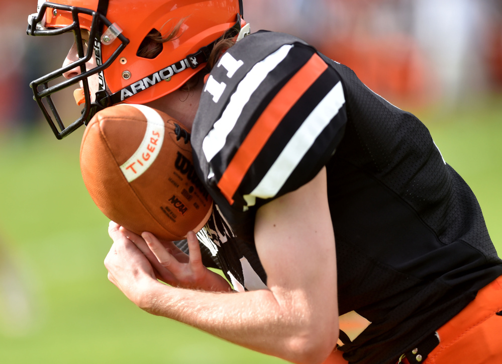 Winslow High School's Tom Tibbetts (11) intercepts a pass from Gardiner's Cole Heaberline (12) on Saturday in Winslow.