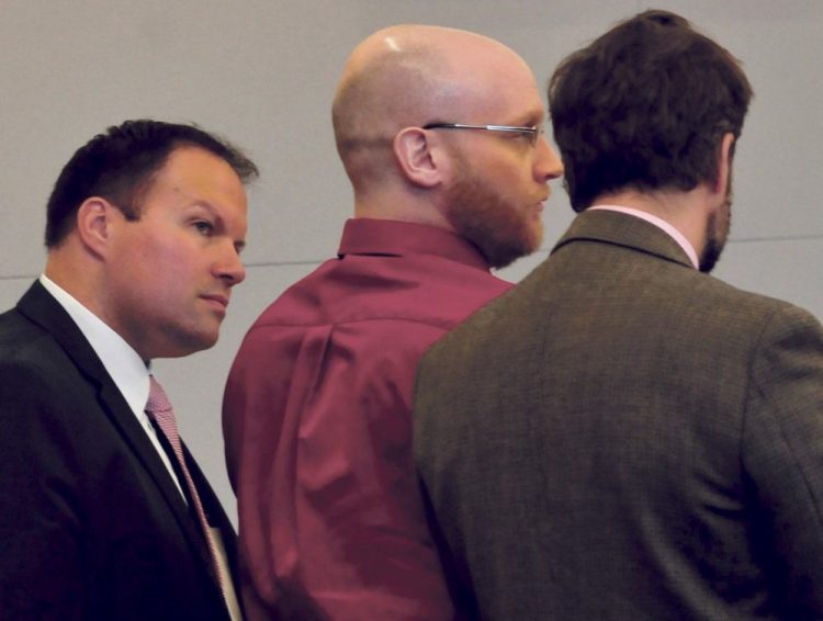 Robert Burton, center, listens to the guilty verdicts being read alongside his attorneys, Zachary Brandmeir, left, and Hunter Tzovarras, at Penobscot Judicial Center in Bangor on Thursday.