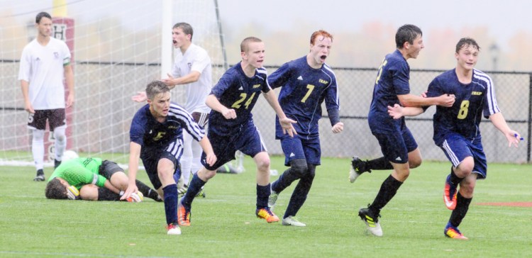 Traip celebrates taking a 2-1 lead over Monmouth late in second half of a rain soaked Class C South quarterfinal game Thursday at Kents Hill School.