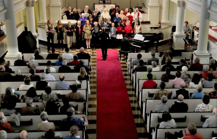 A choir sings during an Ecumenical Gospel Celebration of the 500th anniversary of the Reformation in the packed Lorimer Chapel at Colby College in Waterville on Sunday.