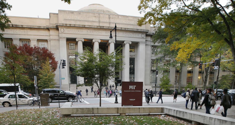 Students walk on the campus of the Massachusetts Institute of Technology in Cambridge. The state's Supreme Judicial Court will hear arguments Tuesday in a lawsuit filed against the university by the family of graduate student Han Nguyen, who killed himself in 2009.