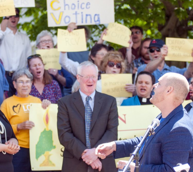 Kyle Bailey of the Committee for Ranked Choice Voting speaks during a June rally promoting the voting system. Mainers approved the method in 2016, but state lawmakers have voted to delay its implementation until 2021.