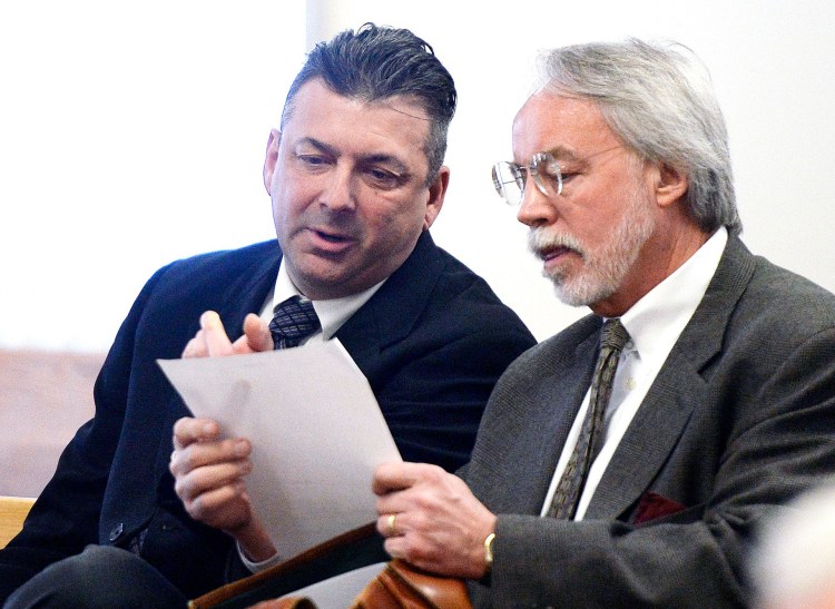 Thomas Fortier, left, seen in court with his attorney Bruce Merrill in March, testified during his theft trial that it's "not for me to say" whether two teenagers lied when they said he told them to charge for parking at a town-owned lot on July 4, 2016.