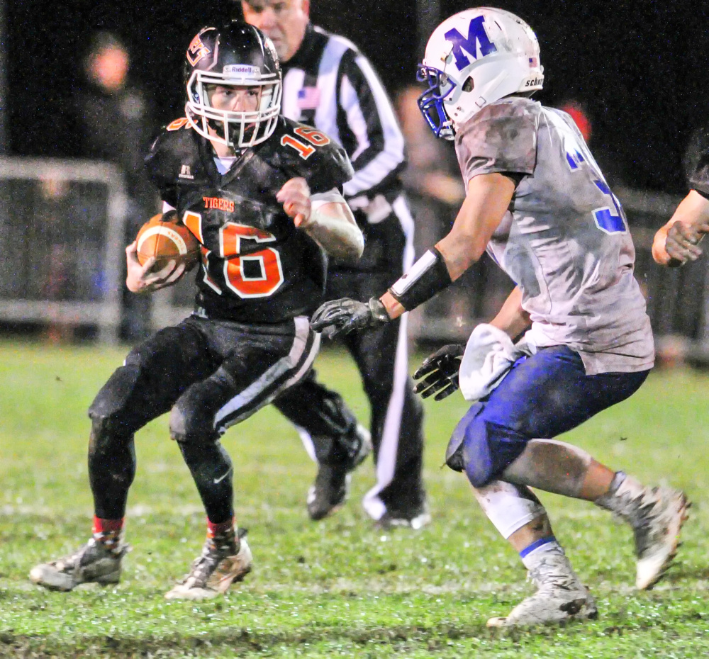 Gardiner's Collin Foye (16) tries to get around Morse's Austin Baltazar during a C South quarterfinal game Friday at Hoch Field in Gardiner.