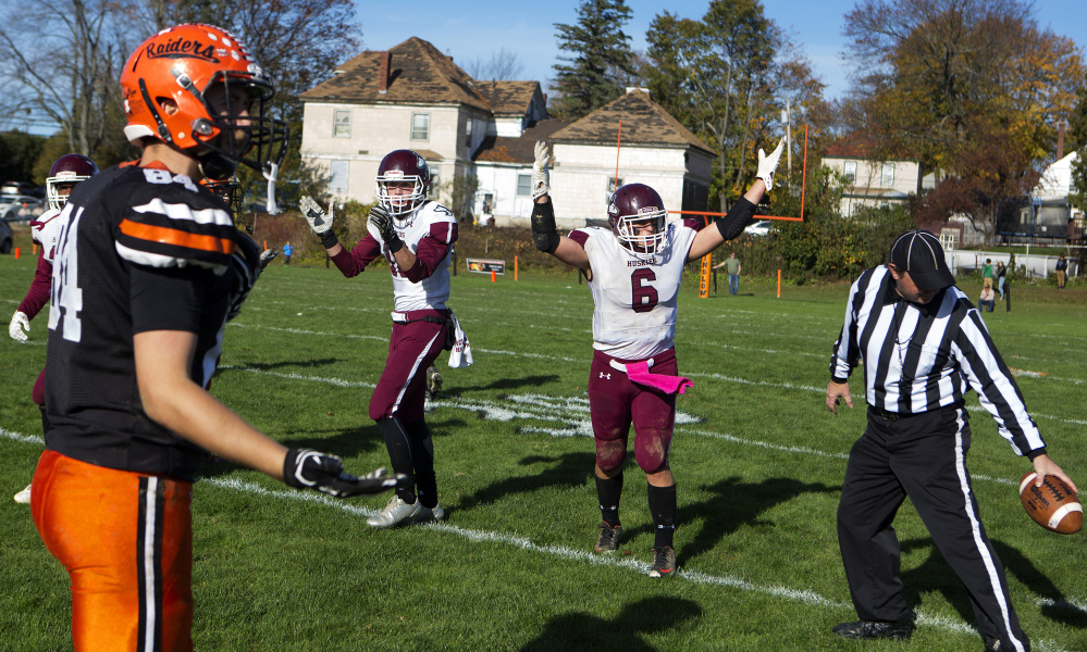 Maine Central Institute's Adam Bertrand (6) celebrates after the official says that David Young's catch was inbounds while Winslow's Hunter Campbell shows his disbelief during a Class C North semifinal game Saturday at Poulin Field in Winslow.