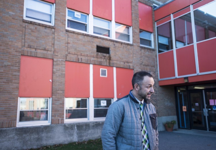 Jason Briggs, principal of Winslow Junior High School, stands outside the school at the end of the school day Wednesday in Winslow.