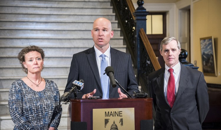 Toni Richardson, left, filed charges of religious discrimination and retaliation with the Equal Employment Opportunity Commission against the Augusta School Department, for which she works as an educational technician. She is joined by her attorneys Jeremy Dys, center, and Timothy Woodcock. Richardson claims the Augusta schools punished her for using religious phrases while in private conversations with a coworker.