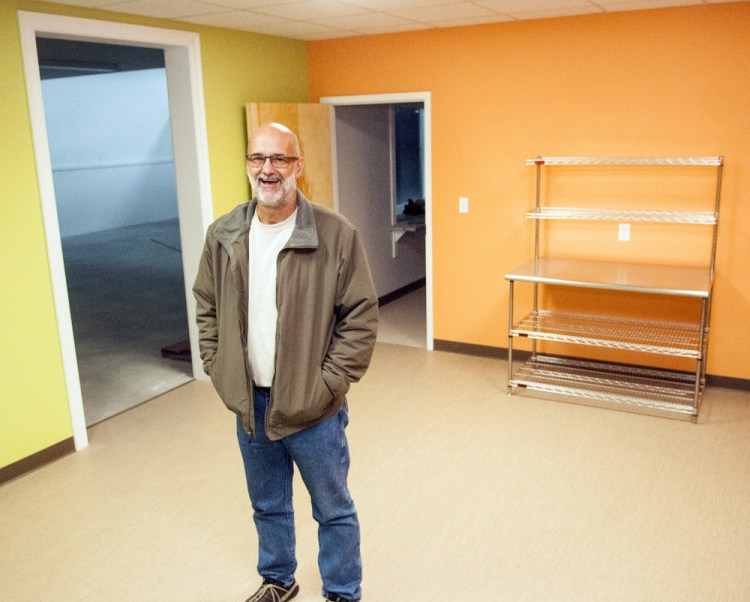 Executive Director Alan Smith leads a tour Tuesday at the new site of the Augusta Food Bank in Augusta.