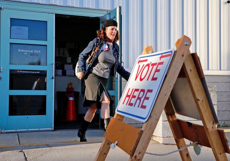 Rosemary Warnock, a registered nurse at Maine Health, leaves the Merrill Auditorium voting station early on Tuesday after casting her ballot. Warnock said she was particularly motivated to vote in favor of MaineCare expansion and oppose the casino proposal. 