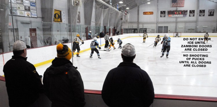 Spectators watch a Maranacook bantam youth hockey team play Presque Isle on Saturday at Kents Hill School.