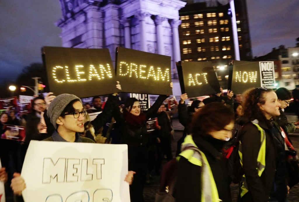 Protesters gather at Grand Army Plaza near the home of Sen. Charles Schumer, D-N.Y, Tuesday in the Brooklyn borough of New York, to register their displeasure at the senator's lack of progress on a DACA deal.