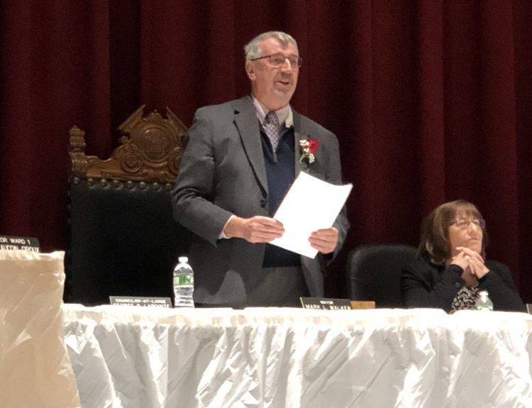 Mayor Mark Walker speaks during Hallowell's annual inauguration ceremony on Tuesday night. At right is City Councilor Lynn Irish.