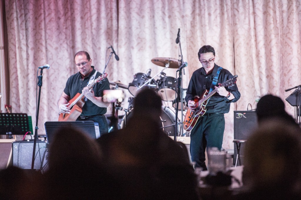 Kevin Michaud, left, and his son, Armando Michaud, right, perform at the Operation HOPE benefit concert at the Elk's Lodge in Waterville on Saturday. The benefit was used to raise money for people suffering substance abuse disorder.