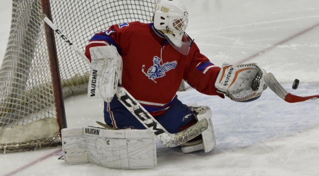 Messalonskee goalie Eli Michaud makes a save against Lawrence/Skowhegan/MCI on Monday at Alfond Rink in Waterville.