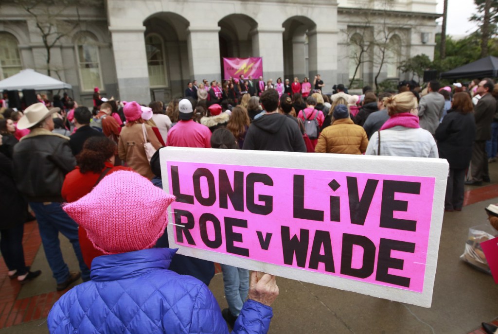 FILE - In this Jan. 22, 2018 file photo, supporters attend a rally held by Planned Parenthood, commemorating the 45th anniversary of the landmark Roe vs. Wade Supreme Court ruling at the Capitol in Sacramento, Calif. The landmark 1973 decision affirmed a woman's right to have an abortion. On Tuesday, Feb. 13, 2018, Planned Parenthood announced an initiative of its own aimed at promoting reproductive health care initiatives in all 50 states over the coming months. (AP Photo/Rich Pedroncelli)