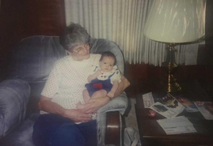 Shirley Higginbotham holds her granddaughter Emily in 1994 in the living room of her home in Bartonville, Illinois.