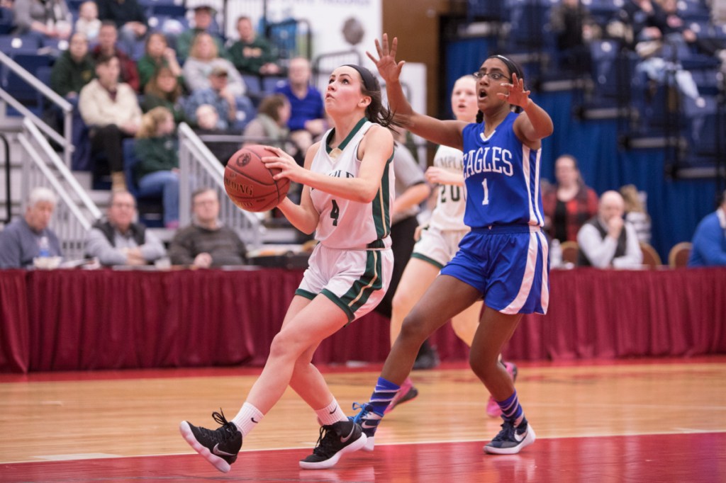 Temple sophomore guard Deleyni Carr goes up for a layup as Islesboro defender Ava Schlottman gives chase during a Class D South quarterfinal game Satruday morning at the Augusta Civic Center.