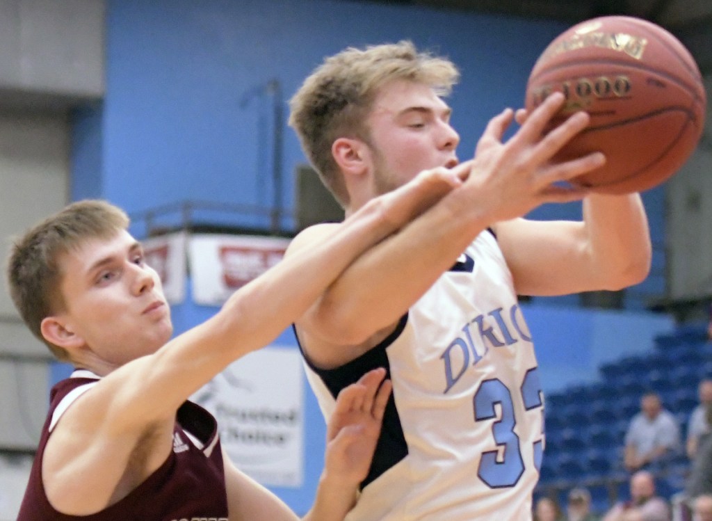 Richmond's Nathan Kendrick gets hand on Dirigo's Cooper Chiasson during a Class C South quarterfinal game Monday night at the Augusta Civic Center.