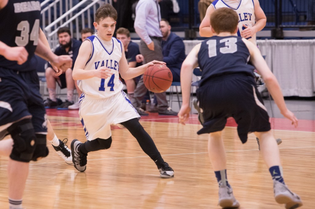 Valley guard Joey Thomas looks for an opening to get past Gould defender Tristin Chamberlain during a Class D South semifinal Wednesday morning at the Augusta Civic Center.