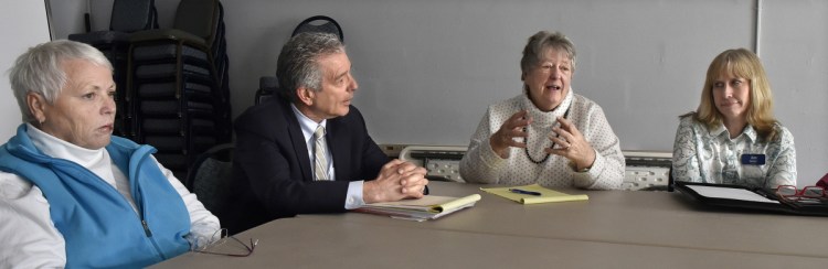 A group of volunteers called Aging Well in Waterville, including, from left, Kim Lane, attorney John Nale, Faye Nicholson and Ann Lindeman, discusses on Tuesday what can be done to assist elderly people in Waterville with a variety of issues and needs.