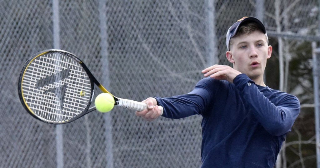 Erskine Academy's Mike Sprague Jr. smacks a shot during practice in South China on Wednesday.