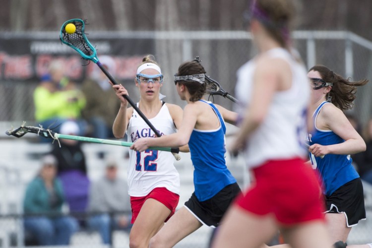 Messalonskee's Ally Turner (12) drives down the field against Mt. Ararat on Friday at Thomas College in Waterville.