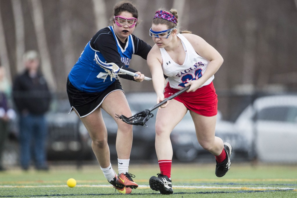 Messalonskee's Jenna Cassani, right, battles for the ball with Mt. Ararat's Maddie Horrocks on Friday at Thomas College in Waterville.