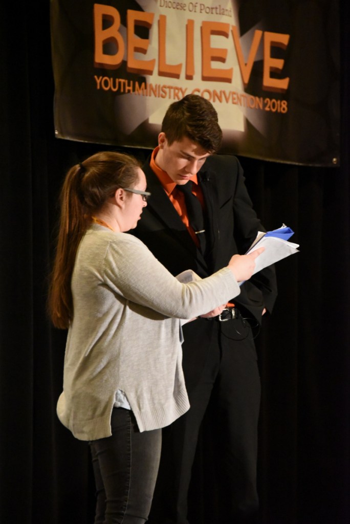 Patrick Carter, right, from St. Michael Parish in Augusta, was the emcee for the youth convention.