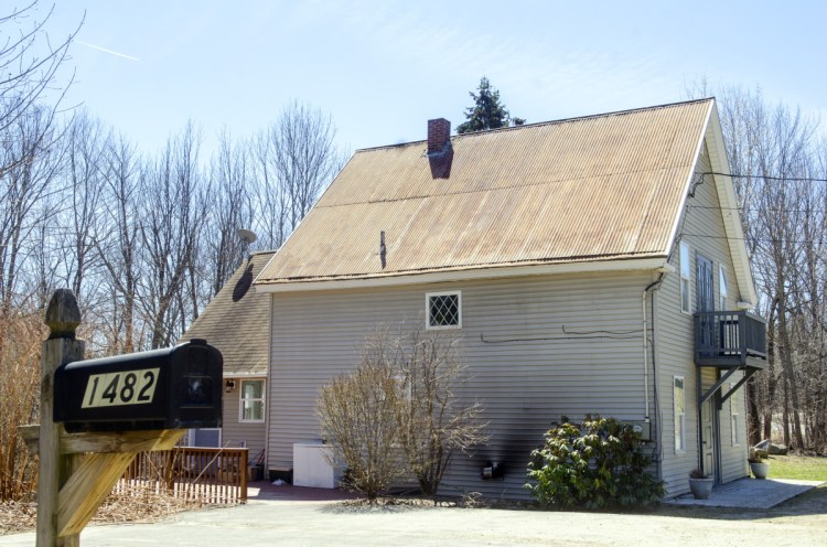 A home at 1482 Hallowell Road in Litchfield is seen Monday, a day after police said they found the body of Kimberly Mironovas there and arrested three teenagers in connection with the woman's death.