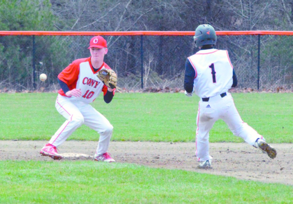 Times Record photo by Eric Maxim
Cony's Mike Boivin (10) catches the throw from catcher Matt Wozniak and tags out Inchino Honda (1) while attempting to steal a base Saturday in Brunswick.