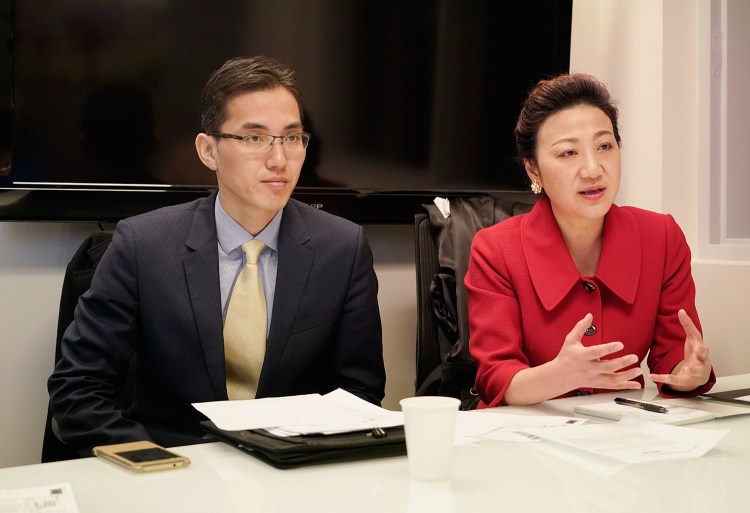 Jin Songbao, left, consul to the Consulate General of the People’s republic of China in New York, and Meifang Zhang, deputy consul general, meet with reporters and editors Monday at the Portland Press Herald in South Portland.