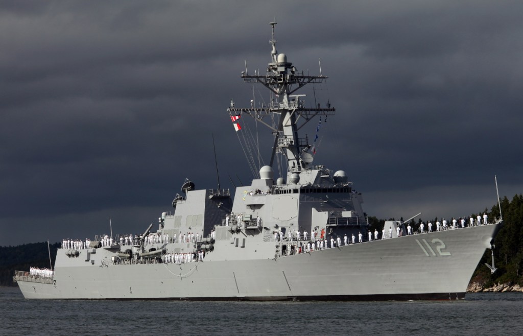 Sailors man the rail on the deck of the Michael Murphy, the last of the U.S. Navy's original run of Arleigh Burke destroyers, as it heads down the Kennebec River off Phippsburg on Sept. 5, 2012.