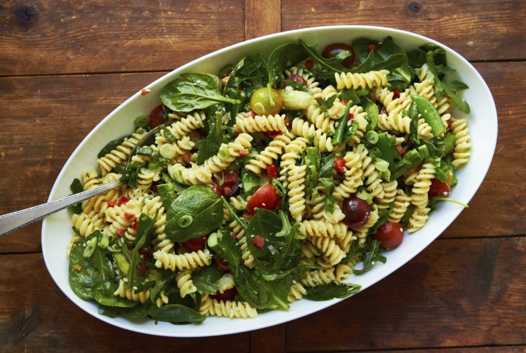 If you chop the leafy greens, they'll blend into the salad more. But you can also leave them whole without overpowering the noodles.