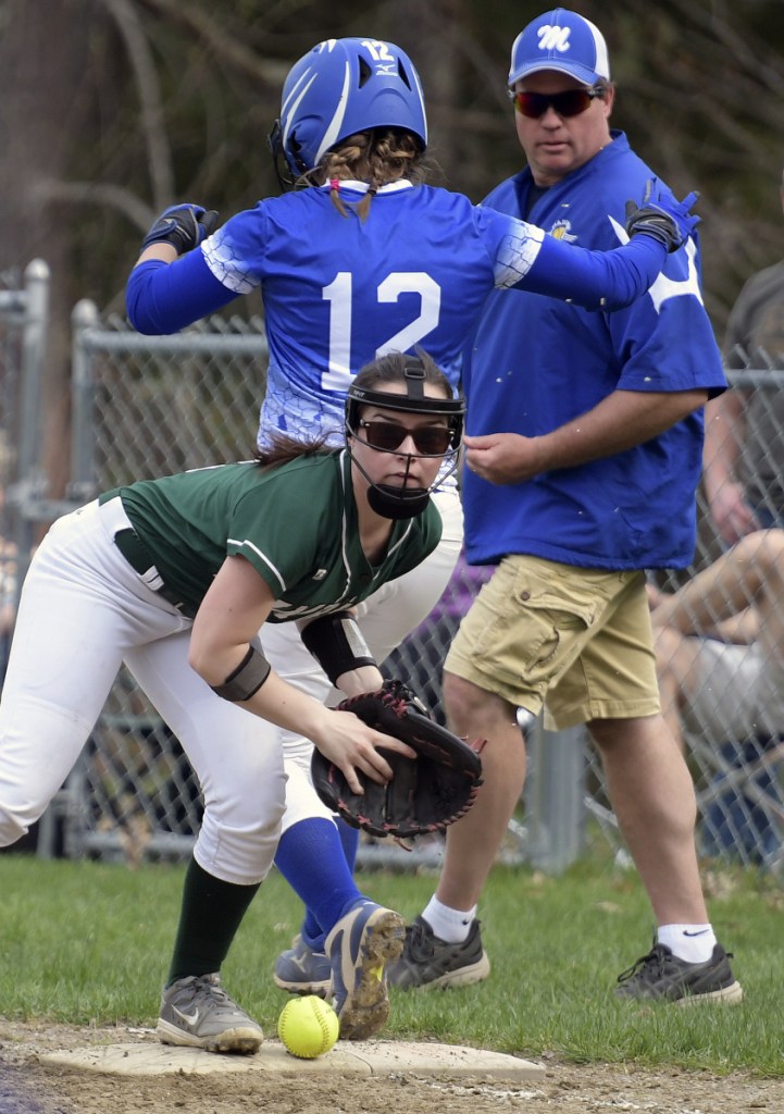 Winthrop's Moriah Hajduk can't hold a throw to first to contain Madison's Lauria LeBlanc (12) during a softball game Wednesday in Winthrop.