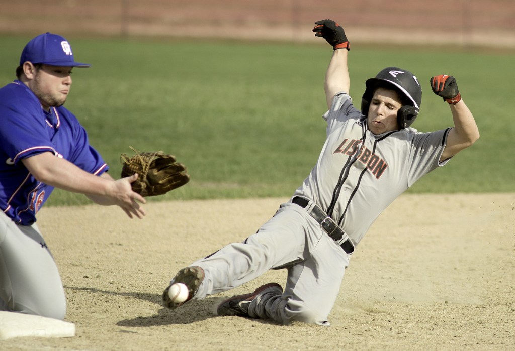 Cole Bolduc of Lisbon beats the throw to Oak Hill third baseman Casey Dion while stealing third Wednesday at Lisbon High School.