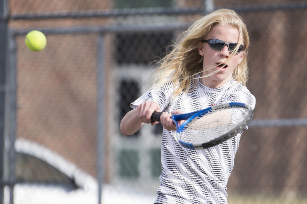 Eli Spahn returns a shot during a match at Carrabec High School in North Anson on Wednesday.