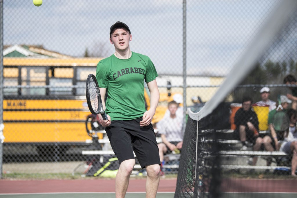 Carrabec High School's Scott Mason watches a shot from Hall-Dale High School's Eli Spahn soar over the net for the point at Carrabec High School in North Anson on Wednesday.