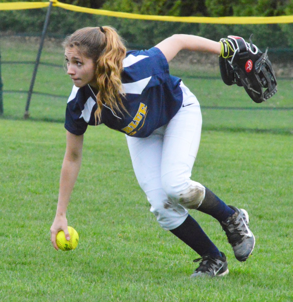 Mt. Blue right fielder Sam Ellis stumbles while coming up with a Brunswick base hit during Friday's KVAC clash in Brunswick.