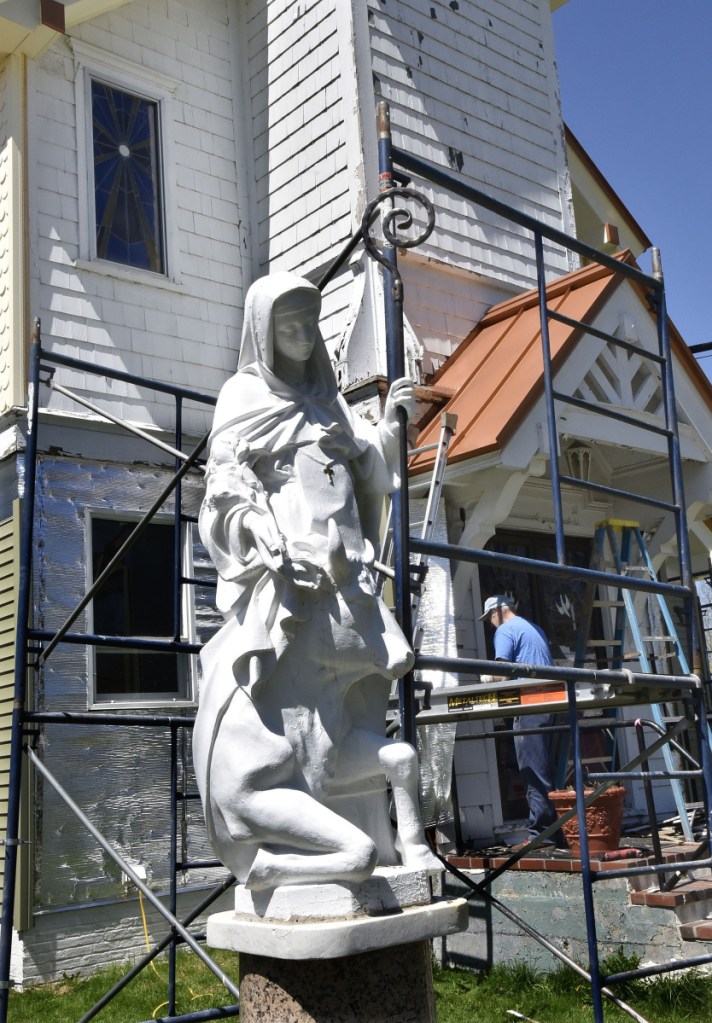 James Kilbride installs new siding at the former St. Bridget Catholic Church, now St. Bridget Center, on May 9 in Vassalboro. The building will be available for community events and can be rented for functions, according to co-owner Rachel Kilbride. The first event will be the Senior Services fair, to be held Wednesday.