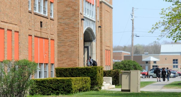 Students emerge from Winslow Junior High School at the end of the school day in May 2016. A document that reportedly details the tax impact of school budgets and a bond issue but does not include the costs avoided by closing the junior high and consolidating grades into two schools has become a bone of contention in the politics surrounding education costs in Winslow.