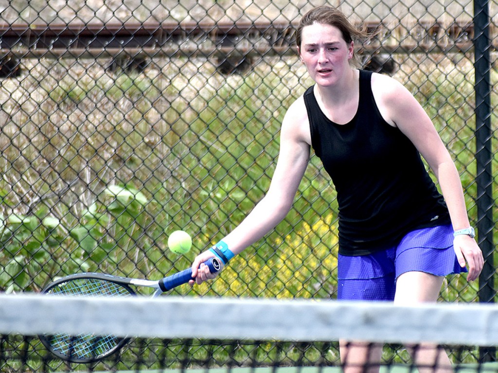 Carrabac High School's Katrina Mason returns the ball to Cara Foggarty of York during their Round of 32 match Friday in Portland.