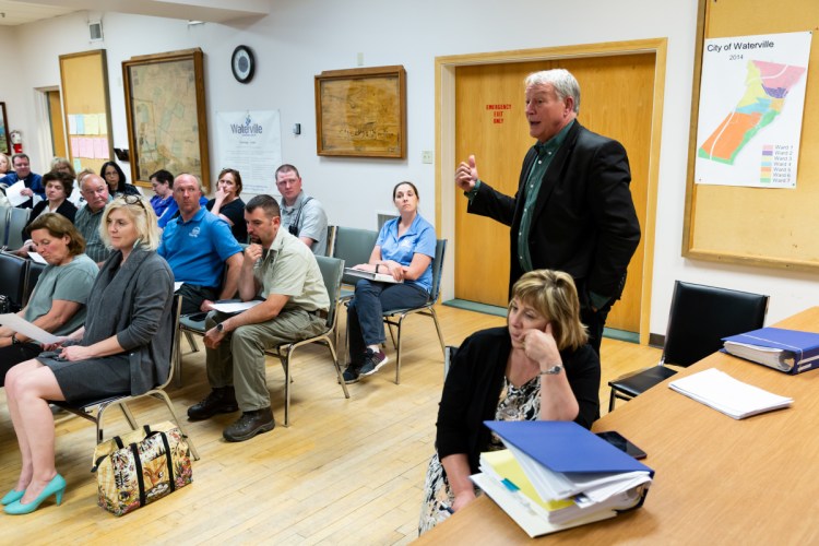 AOS 92 Superintendent Eric Haley explains the school budget Tuesday to the gathered residents during the City Council budget meeting.