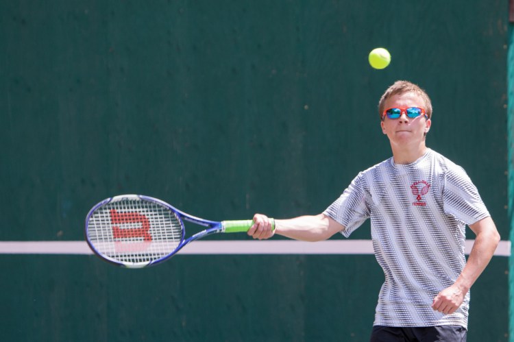 Hall-Dale's Colby Gardner returns a shot in a doubles match against Dirigo in the Class C South semifinals Saturday morning in Farmingdale.