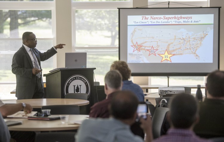 Karl Colder, retired special agent for the Drug Enforcement Agency in Washington, D.C., speaks on Friday to a room full of law enforcement officials, first responders, school administrators and other community stakeholders from across the state at Wyman Commons at Unity College. Colder said law enforcement has learned that incarcerating addicted populations is not a solution to what is now perceived as a public health problem