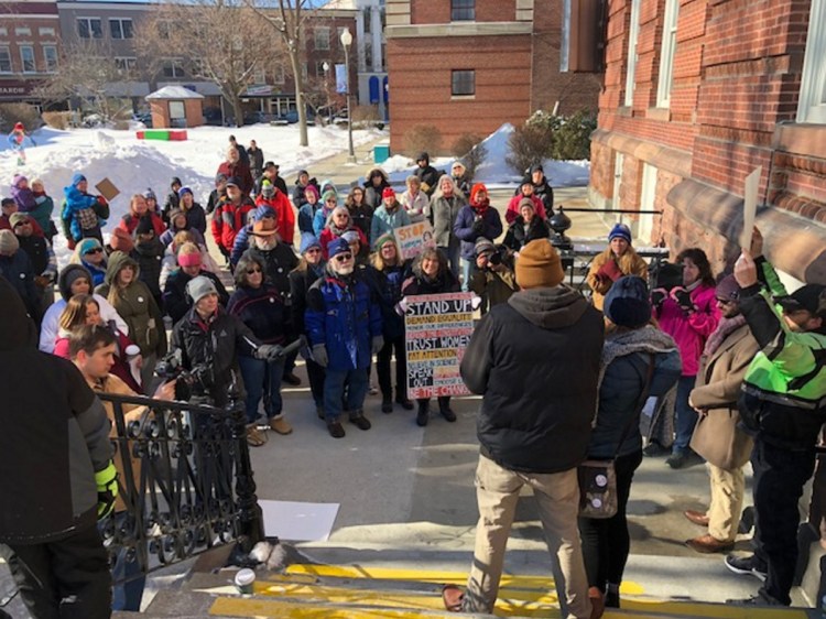 A crowd rallies on Feb. 3 outside City Hall in Waterville to support Lexius St. Martin, a Haitian who came to the U.S. legally as a child refugee but was deported for violating his immigration status, and Mindy St. Martin, who married him. Lexius St. Martin's supporters say he had turned his life around and started his own business. The couple have three children. Rallies in Augusta and Farmington this Saturday are part of a nationwide protest against Trump immigration policies.