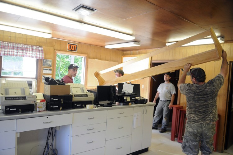 Items are removed from the former town office June 16, 2016, in Belgrade.